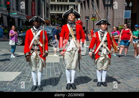 Boston Harborfest Redcoats Soldiers dressed in British Army Uniform reinact a key ceremony parade in front of The Old State House Boston Massachusetts Stock Photo