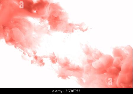 Coral ink splashes abstract background. Studio shot with seamless watercolor swirls in the water Stock Photo