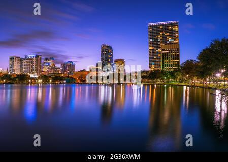 Night skyline of Orlando, Florida, with Lake Eola in the foreground Stock Photo