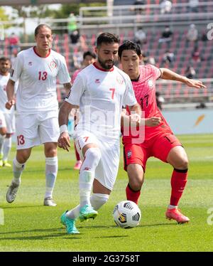 Goyang, South Korea. 13th June, 2021. South Korea's team player Song Min-Kyu (R), and Lebanon player Hassan Saad, fight for the ball during a 2022 FIFA World Cup Asia qualification Round 2 Group H match between South Korea and Lebanon at the Goyang Stadium in Goyang, South Korea on June 13, 2021. South Korea win 2-1. (Photo by Lee Young-ho/Sipa USA) Credit: Sipa USA/Alamy Live News Stock Photo