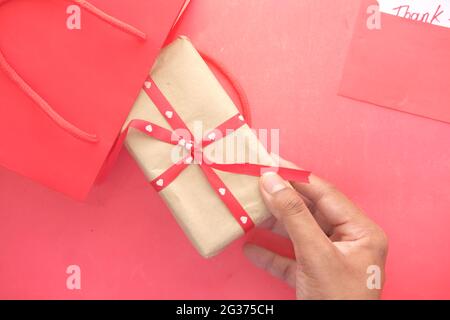 putting gift box in a shopping bag  Stock Photo
