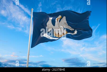 flag of Louisiana at cloudy sky background on sunset. Patriotic concept about state. 3d illustration, Stock Photo