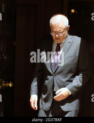 Prime Minister Scott Morrison leaves after meeting with a family ...