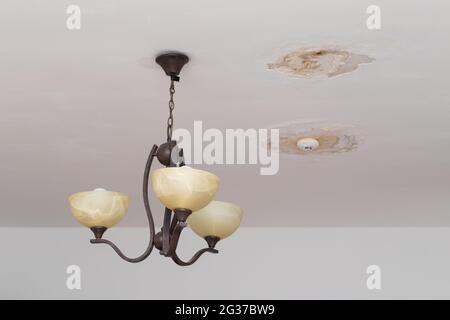 Damp on a wall causing damage and peeling paint Stock Photo