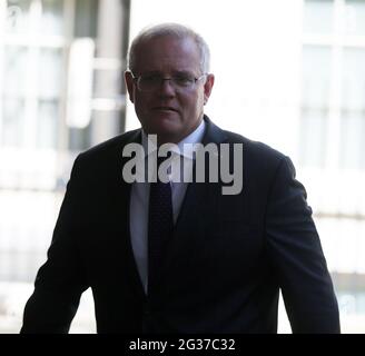 Prime Minister Scott Morrison leaves after meeting with a family ...