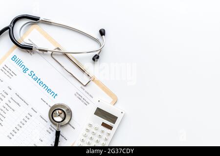 Medical billing statement with stethoscope. Top view Stock Photo