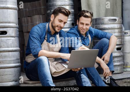 Online conference in workplace, modern device for factory and brewery Stock Photo