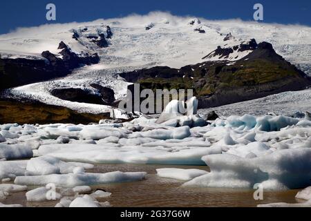 Icebergs, floating ice chunks, glacial ice, glacier, calving glacier, glacial lagoon, glacial lake, Fjallsarlon glacial lagoon, Vatnajoekull Stock Photo