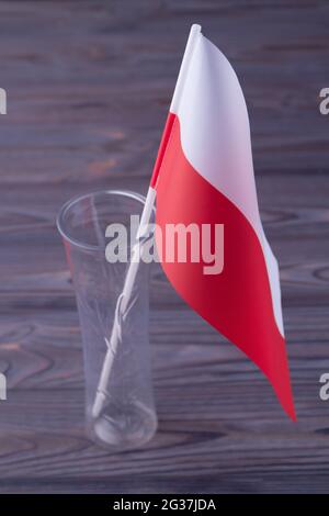 Vertical shot red and white flag of Poland in the glass vase. Stock Photo