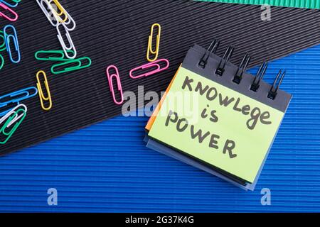 Knowledge is power quote written on the small note book. Stock Photo