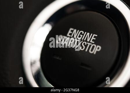 Black Interior Car Stop and Start Engine Button Close Up. Automotive Technologies Theme. Stock Photo