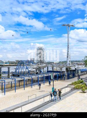 London skyline showing the Emirates Air Line cable car that crosses the River Thames at Greenwich Peninsular. Which is home to the London O2. Stock Photo