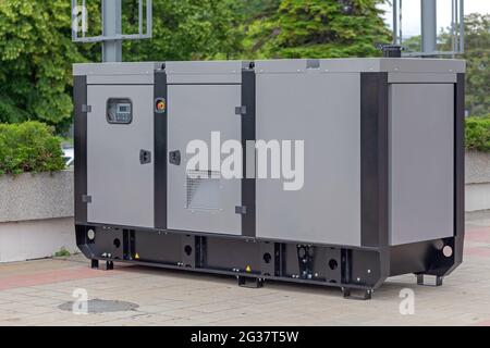 Big Electric Power Emergency Generator Unit Outside Stock Photo