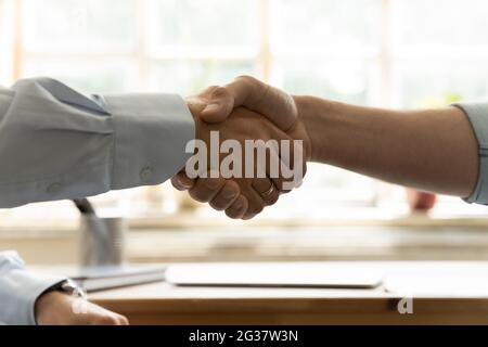 Close up two business men shaking hands, making agreement. Stock Photo