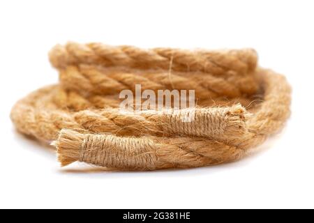 jute rope with sealed ends rolled in coil isolated on white background Stock Photo