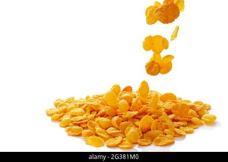 closeup of falling corn flakes isolated on white background Stock Photo