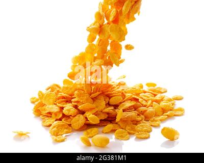 closeup of falling corn flakes isolated on white background Stock Photo