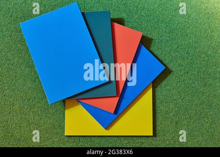 rectangular multicolored texture tiles on a green background Stock Photo