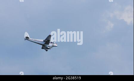 Vintage De Havilland DH.89A Dragon Rapide G-AGSH in colours of British European Airways in flight. Stock Photo