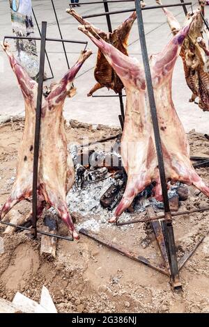Traditional asado - barbecue of a lamb. Plaza Independecia square in Mendoza, Argentina. Stock Photo
