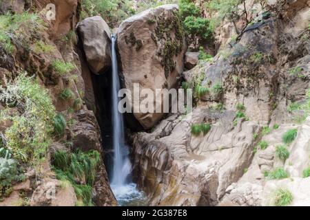 Tall waterfall in Quebrada del Colorado canyon near Cafayate, Argentina Stock Photo