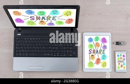 Share concept shown on different information technology devices Stock Photo