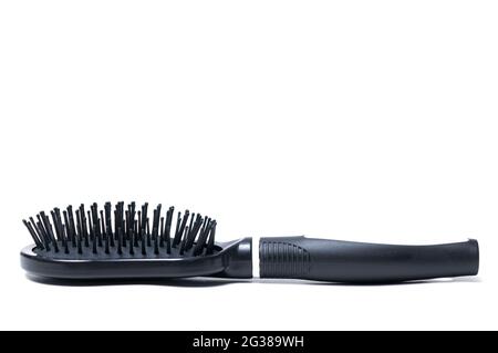 Plastic black professional hair brush on white background Stock Photo