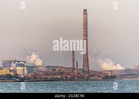Factory with air pollution smoke from chimneys, environmental problems. Industry air pollution concept. Ecological catastrophe. Stock Photo