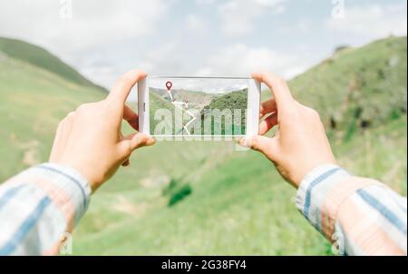 Navigating geolocation points in mountainous terrain. Stock Photo