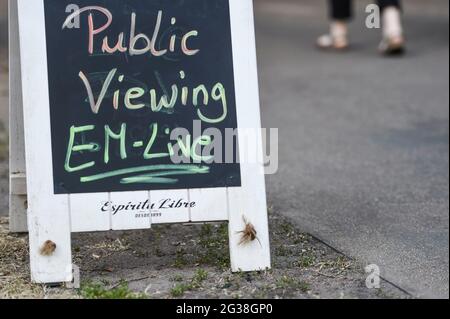 Berlin, Germany. 14th June, 2021. In front of a restaurant there is a sign saying 'Public Viewing EM-Live'. Credit: Kira Hofmann/dpa-Zentralbild/dpa/Alamy Live News Stock Photo