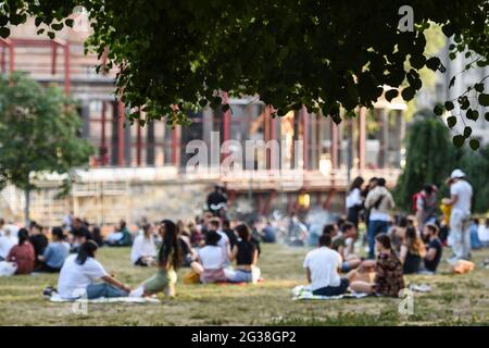 Berlin, Germany. 14th June, 2021. Several groups of people sit in James Simon Park in the evening during warm weather. Credit: Kira Hofmann/dpa-Zentralbild/dpa/Alamy Live News Stock Photo