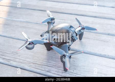 Kiev, Ukraine - April 26, 2021: A new DJI FPV drone on wooden background. Stock Photo