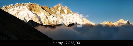 Evening view of Lhotse, Makalu and Nuptse - South rockface - Way to Everest base camp - Nepal Stock Photo