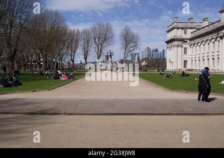 London, UK: the park beside the Royal Naval College of Greenwich. Canary Wharf in the background Stock Photo