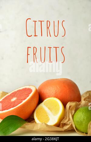 Fresh citrus fruits on light background Stock Photo