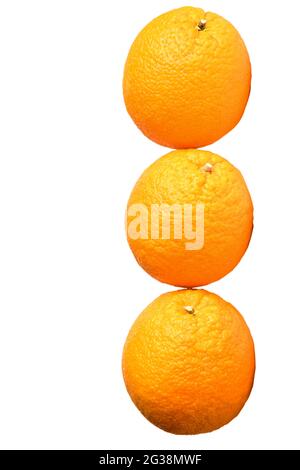 Three large identical oranges lie in a row on a white background Stock Photo