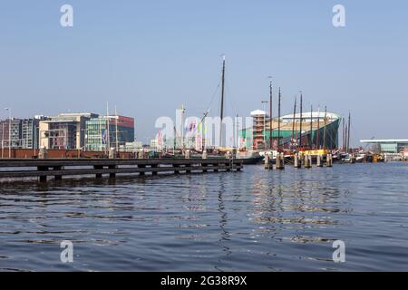 Amsterdam, Netherlands - 12 March 2016: Ships moored in the center of Amsterdam, Oosterdock. Stock Photo