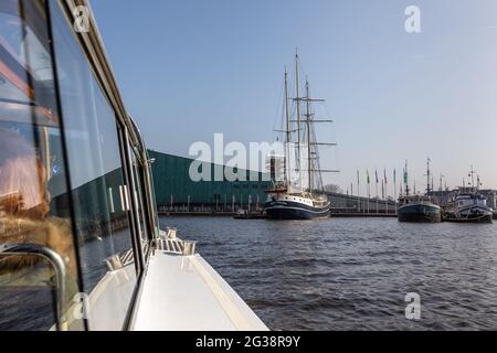 Amsterdam, Netherlands - 12 March 2016: Ships moored in the center of Amsterdam, Oosterdock. Stock Photo