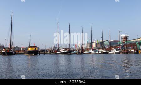 Amsterdam, Netherlands - 12 March 2016: Ships moored in the center of Amsterdam, Oosterdock. Stock Photo