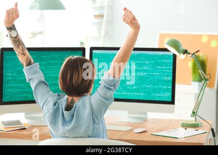 Female programmer working in office Stock Photo