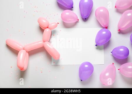 Blank paper sheet and balloon dog on grey background Stock Photo