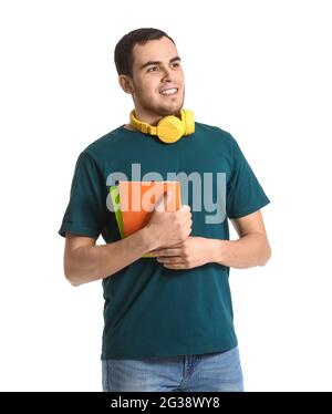 Young man with headphones and notebooks on white background Stock Photo