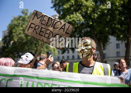 London, UK. 14th June 2021. Anti-vaxx protesters with their slogans. Yuen Ching Ng/Alamy Live News Stock Photo