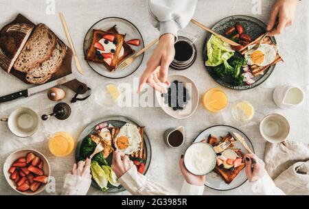 Group of people Friends having breakfast or gathering brunch Stock Photo