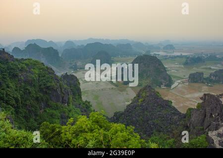 A view of the saturated landscape near Mua Cave in the Ninh Binh province of Vietnam at dusk Stock Photo