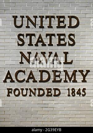 U.S. Naval Academy entrance sign with bold lettering  on white brick in Annapolis, Maryland. Stock Photo