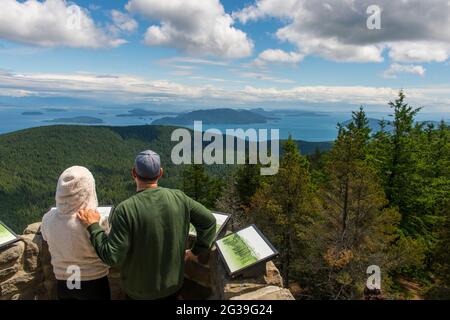 People enjoying the view of the San Juan Islands from the top of Mount Constitution in the Moran State Park on Orcas Island, San Juan Islands in Washi Stock Photo