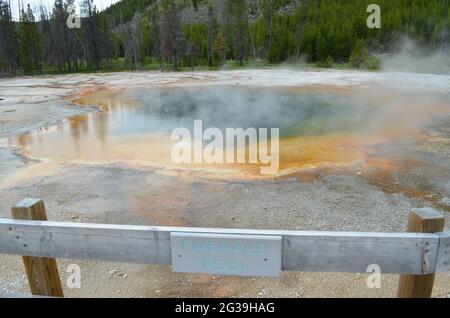 YELLOWSTONE NATIONAL PARK, WYOMING - JUNE 9, 2017: Emerald Pool of the Emerald Group in the Black Sand Basin Area of Upper Geyser Basin Stock Photo