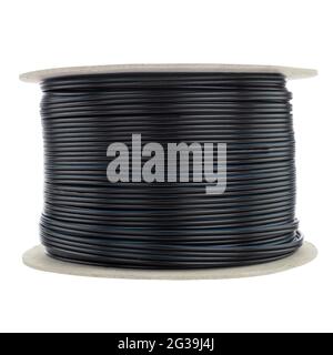 Roll of thick electric cable isolated on a white background. Black cable Stock Photo