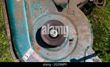 Looking Down on a Pulley on a Mower Deck Stock Photo